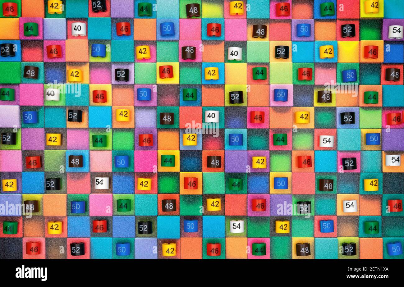Plastic tags with clothing sizes on multicolored squares Stock Photo