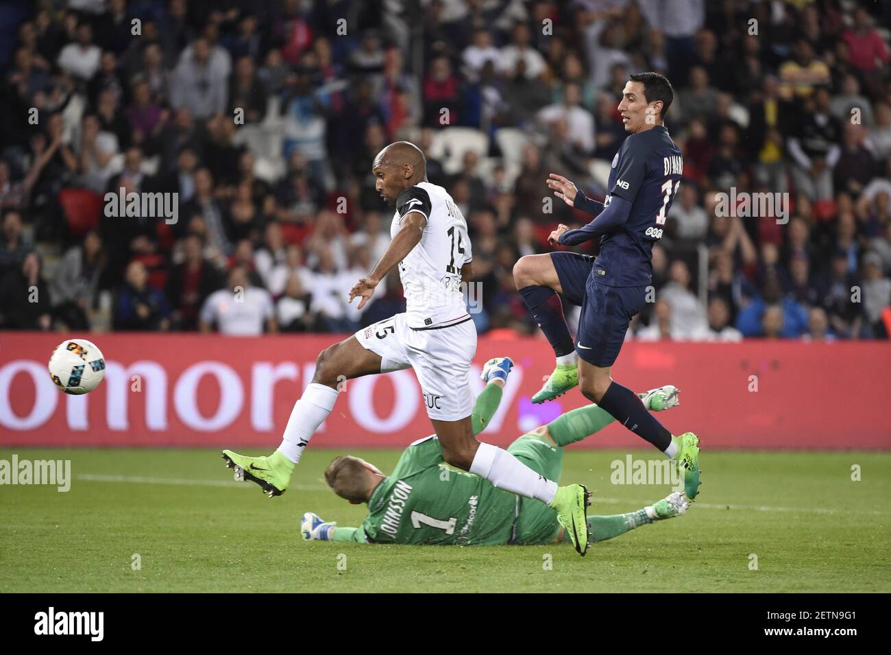 Di Maria Angel (R) from Paris Saint Germain scores the 1st goal for his team despite Sorbon Jeremy (L) and Johnsson Karl Johan (C) from EA Guingamp during the French Ligue 1 Championship soccer match in Parc des Princes stadium in Paris, France on April 9, 2017. Paris Saint Germain won EA Guingamp with 4-0. Photo XinHua / Jean-Marie Hervio (Photo by Xinhua/Sipa USA) Stock Photo