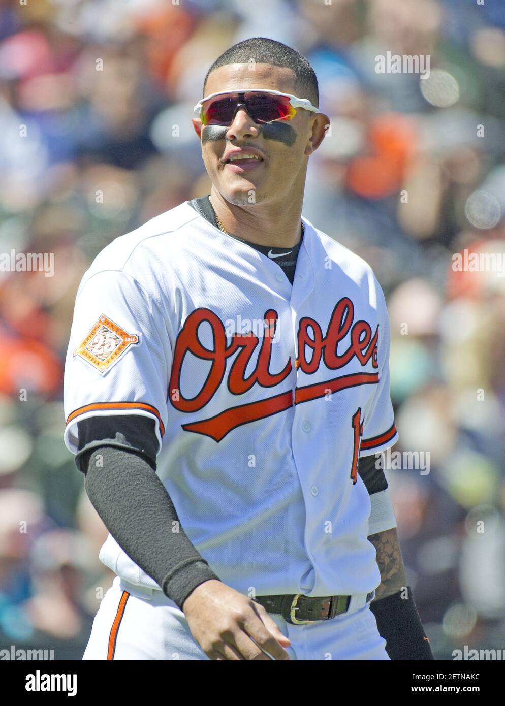 Baltimore Orioles third baseman Manny Machado (13) makes a diving stop on a  ground ball against the Boston Red Sox in the first inning at Orioles Park  at Camden Yards in Baltimore