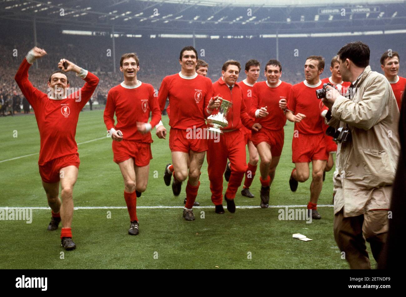 File photo dated 01-05-1965 of (L-R) Liverpool's Ian St John, Geoff Strong, Ron Yeats, Wilf Stevenson, Gordon Milne, Chris Lawler, Ian Callaghan, Peter Thompson, Roger Hunt and Tommy Smith celebrate with the FA Cup after their 2-1 win Issue date: Tuesday March 2, 2021. Stock Photo