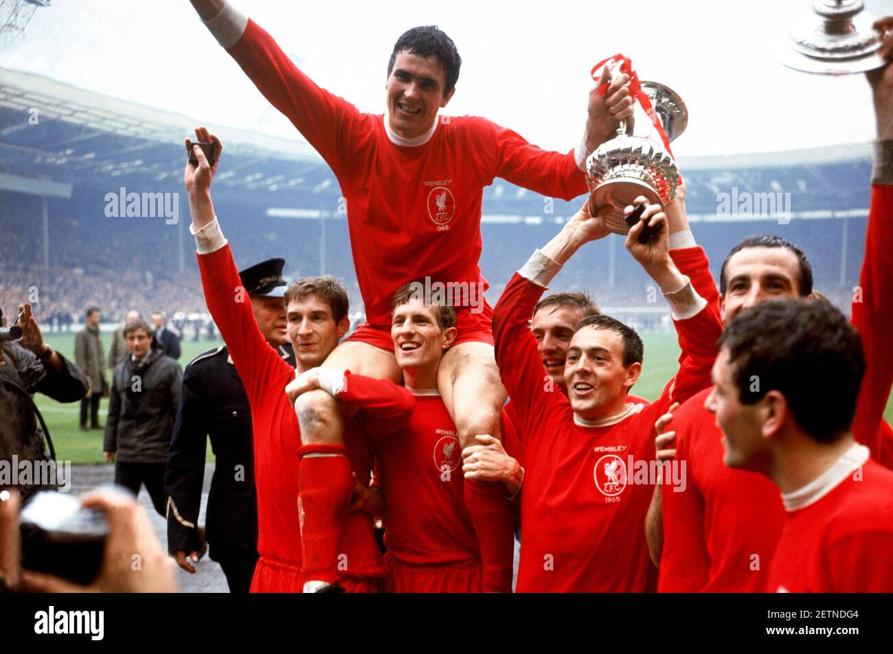 File photo dated 01-05-1965 of Liverpool captain Ron Yeats (top) holds onto the FA Cup as he is hoisted aloft by his jubilant teammates after their 2-1 win: (l-r) Geoff Strong, Yeats, Wilf Stevenson, Peter Thompson, Ian St John, Gerry Byrne, Ian Callaghan Issue date: Tuesday March 2, 2021. Stock Photo