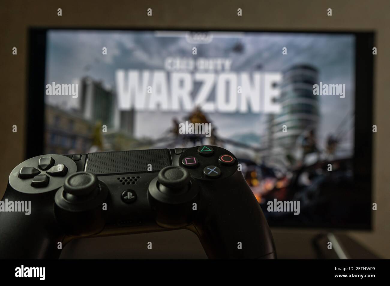 Point of view video gaming. Playing video game on Playstation. Call of Duty Warzone Stock Photo