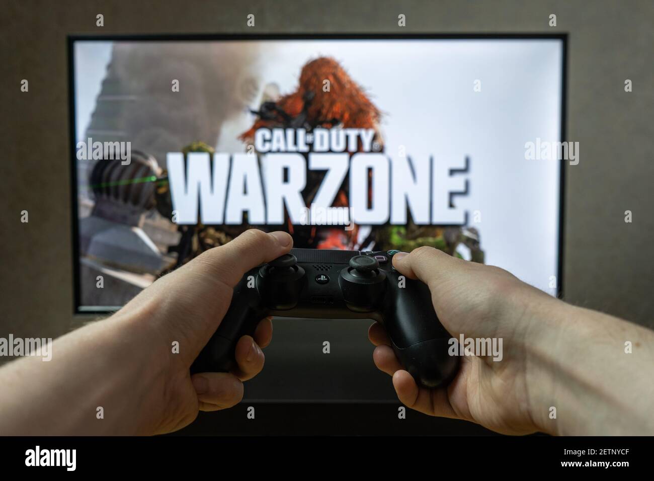 Point of view video gaming. Playing video game on Playstation. Call of Duty Warzone Stock Photo
