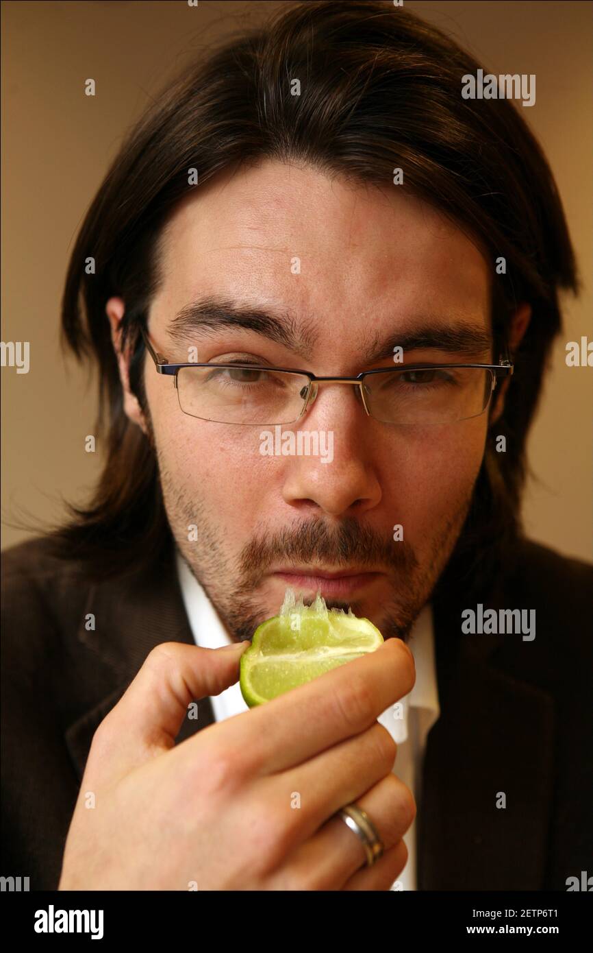 Jerome Taylor tries MIRACLE FRUIT ( Synsepalum Dulcificum) which makes sour and bitter foods taste sweeter.photograph by David Sandison The Independent Stock Photo