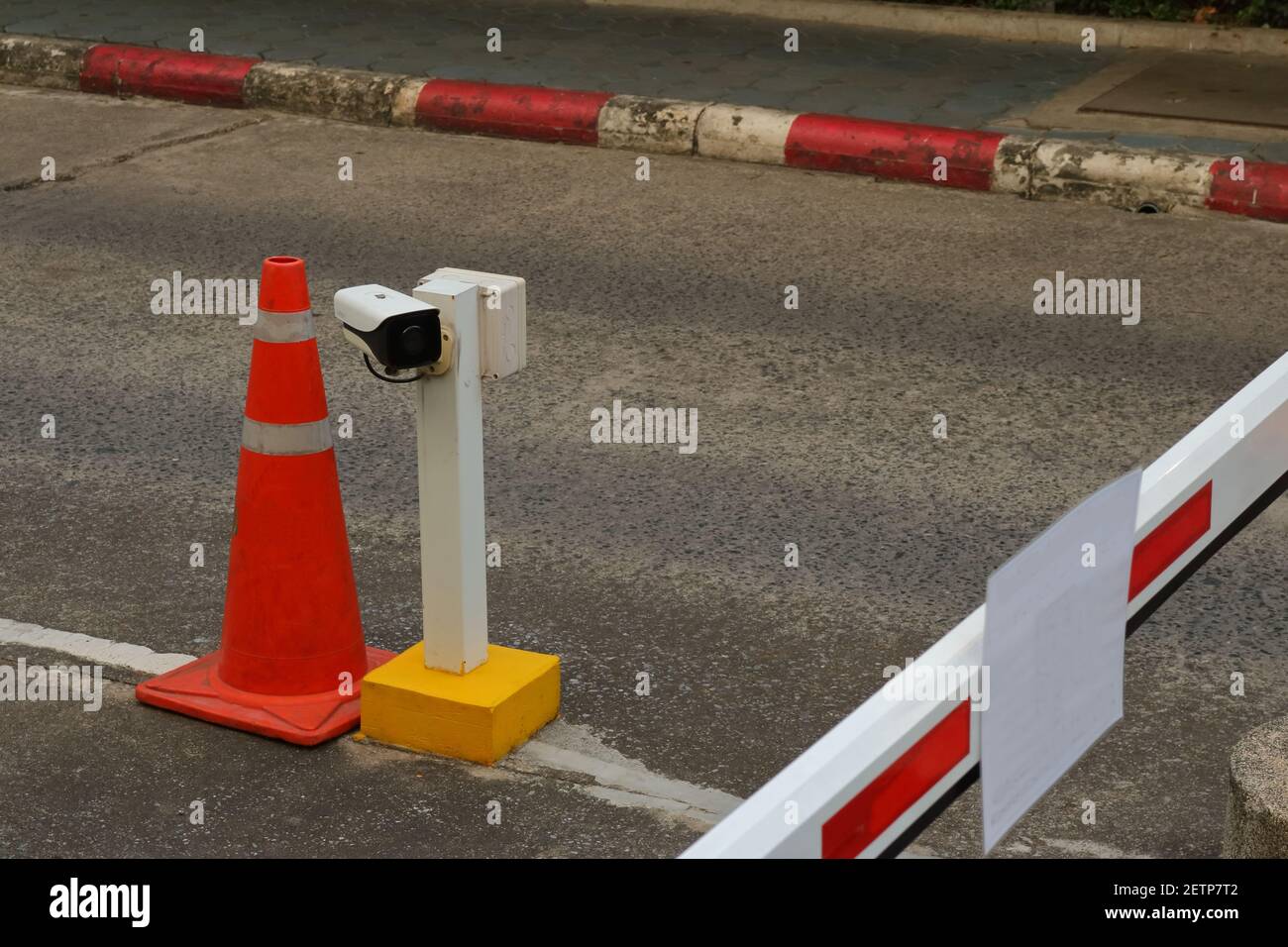 Closeup of security camera installed on upright post fixed to street at security checkpoint for vehicle Stock Photo