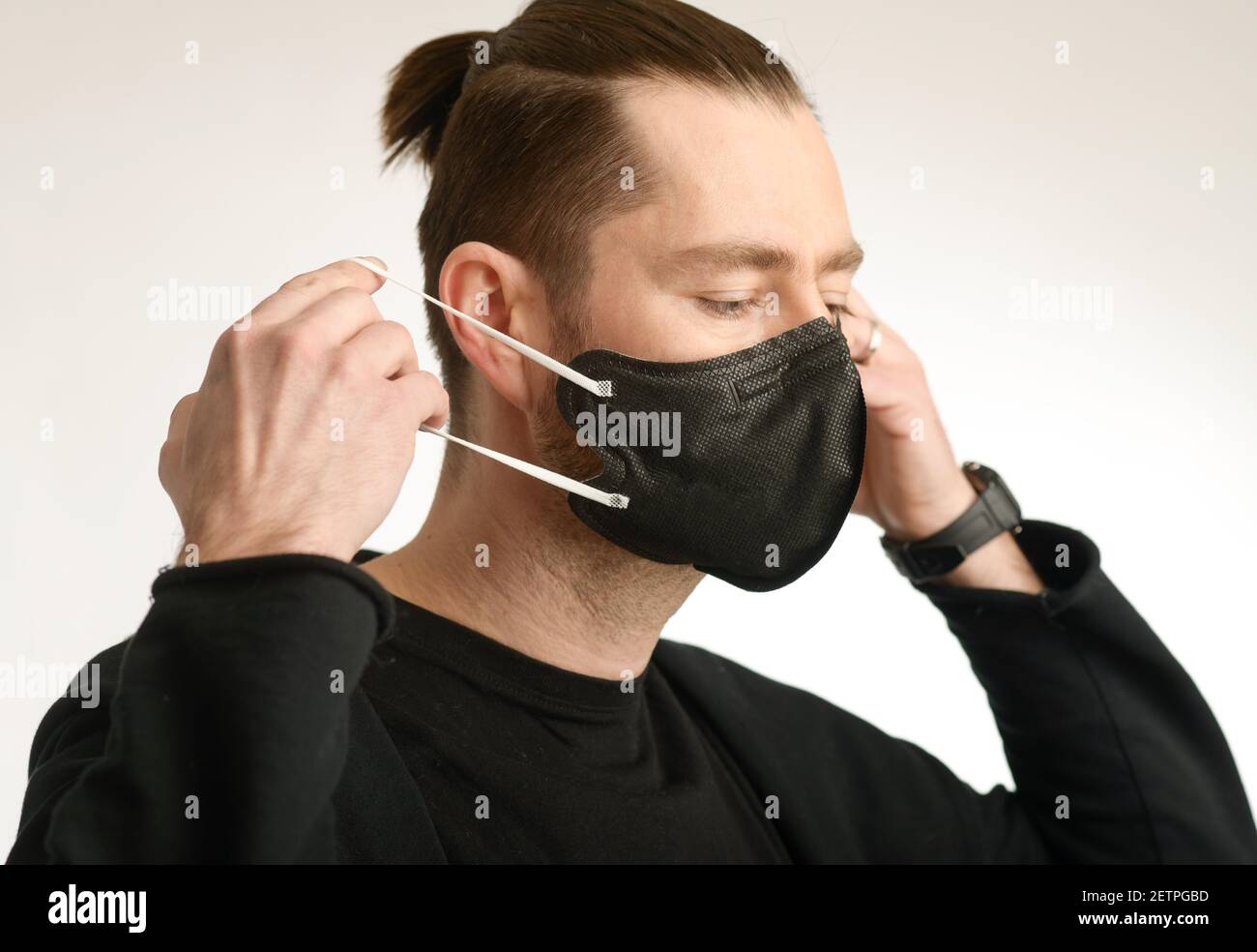 A man wearing a black face mask nano FFP2 Stock Photo