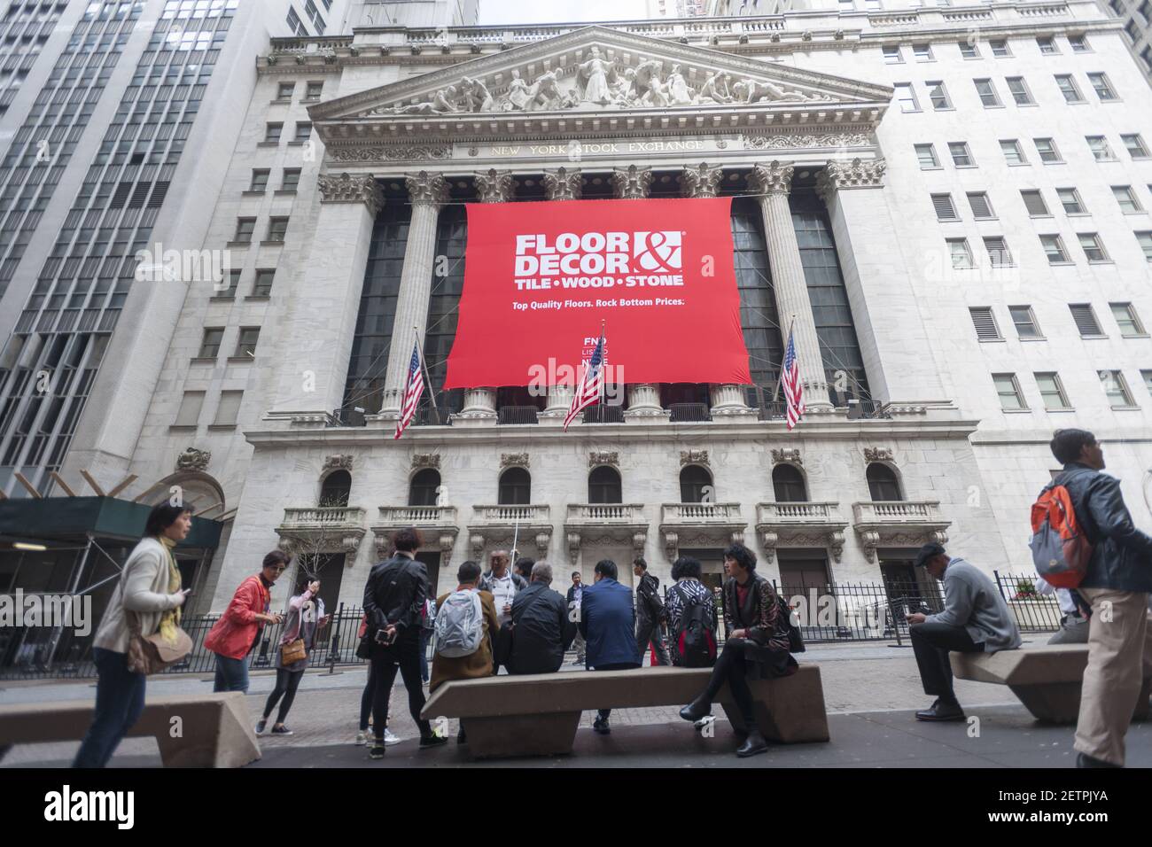 The facade of the New York Stock Exchange is decorated for the first day of  trading for Floor & Decor Holding's initial public offering on Thursday,  April 27, 2017. Floor & Decor