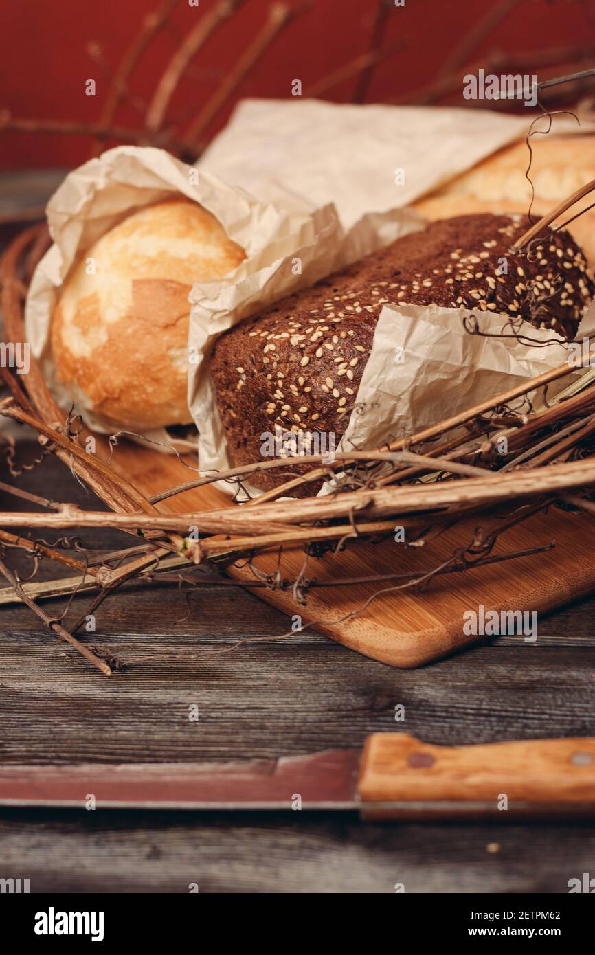 a loaf of fresh bread flour product in a bird's nest on a wooden