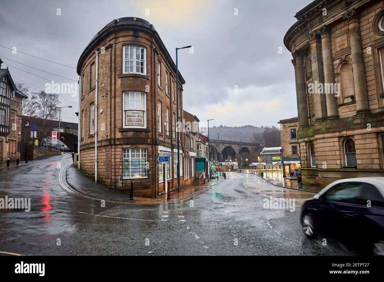 Todmorden viaduct with 11 Burnley Rd offices and Todmorden Town Hall in the wet Stock Photo