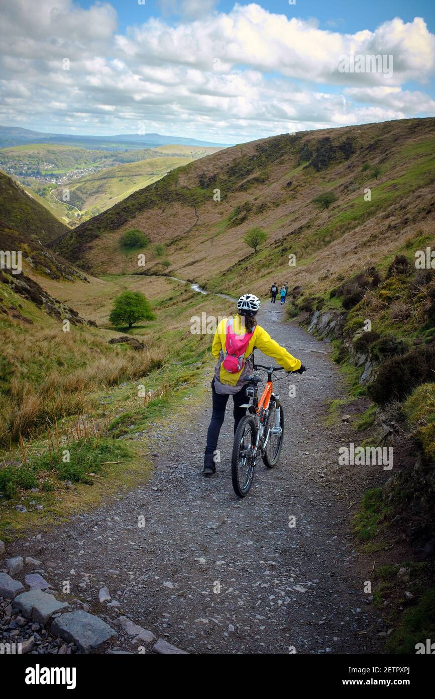 A mountain biker, The Carding Mill Valley on The Long Mynd in the Shropshire Hills, England, UK. Stock Photo
