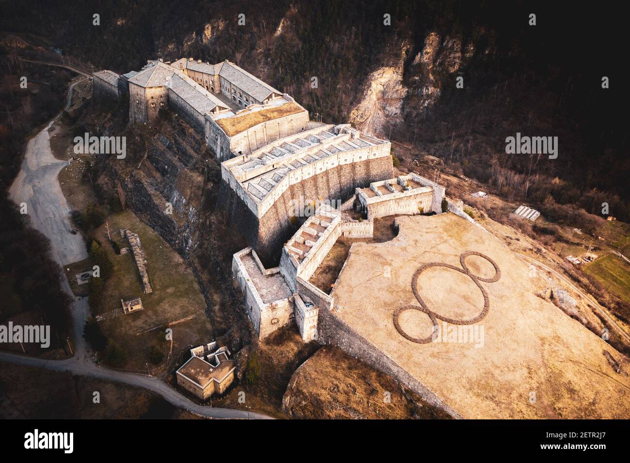 ITALY, EXILLES: Aerial view of the Exilles Fort, a fortified complex reconstructed at the beginning of the 1800s, that was part of the defensive line between Italy and France. It is located in the Susa Valley, along the main road connecting Turin to France. Stock Photo