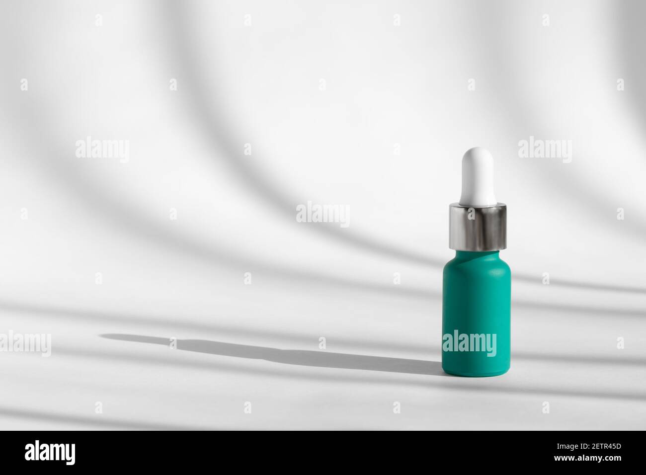 Anti aging serum with collagen, retinol and peptides on white with sunlight  and shadow decor. Liquid essence product packaging bottle. Hyaluronic or  Stock Photo - Alamy