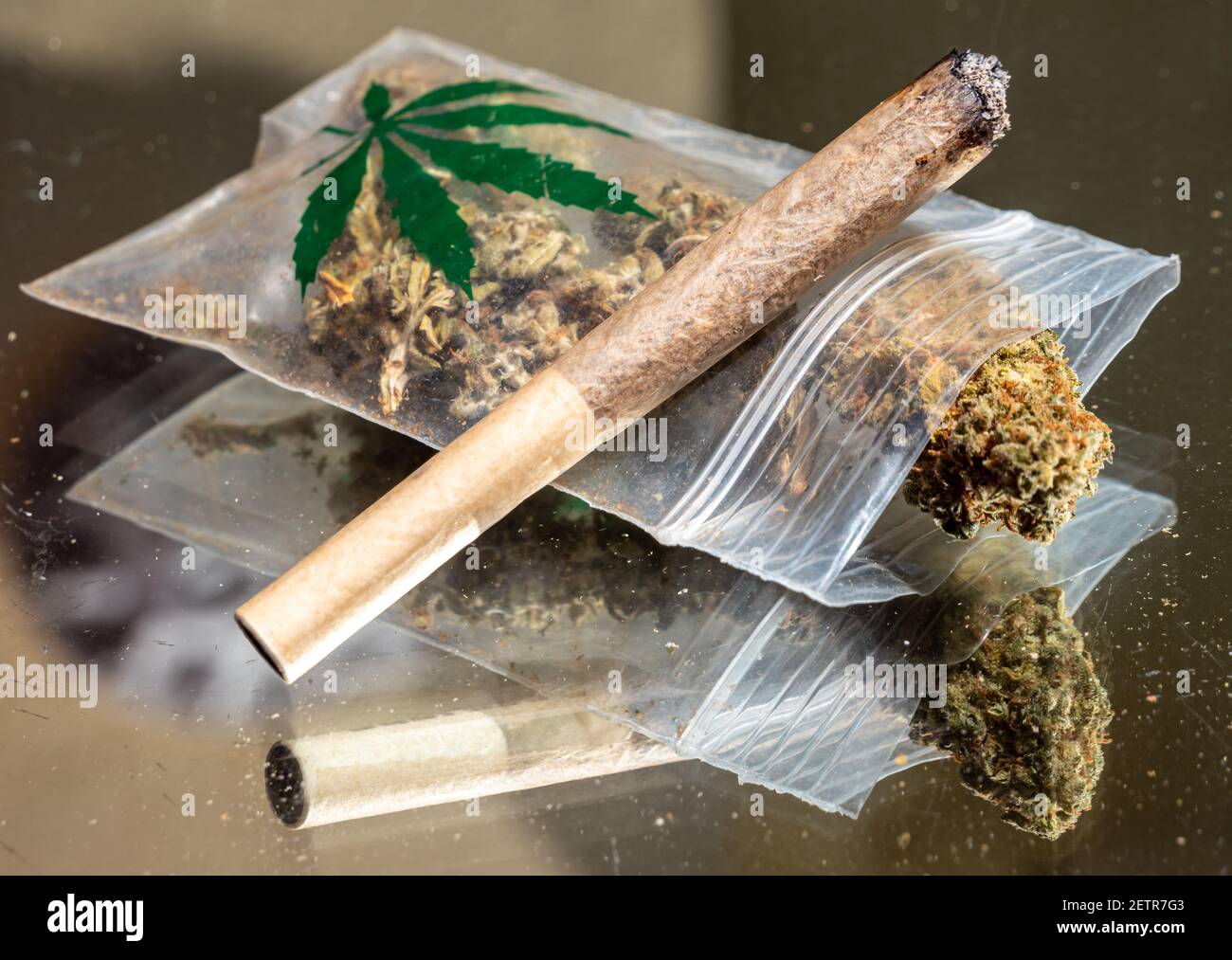 a bag of cannabis with a joint Stock Photo - Alamy