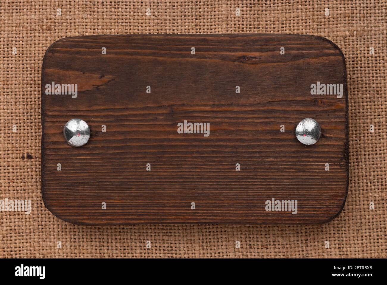 Vintage wooden signboard with iron bolts and place for your text ...