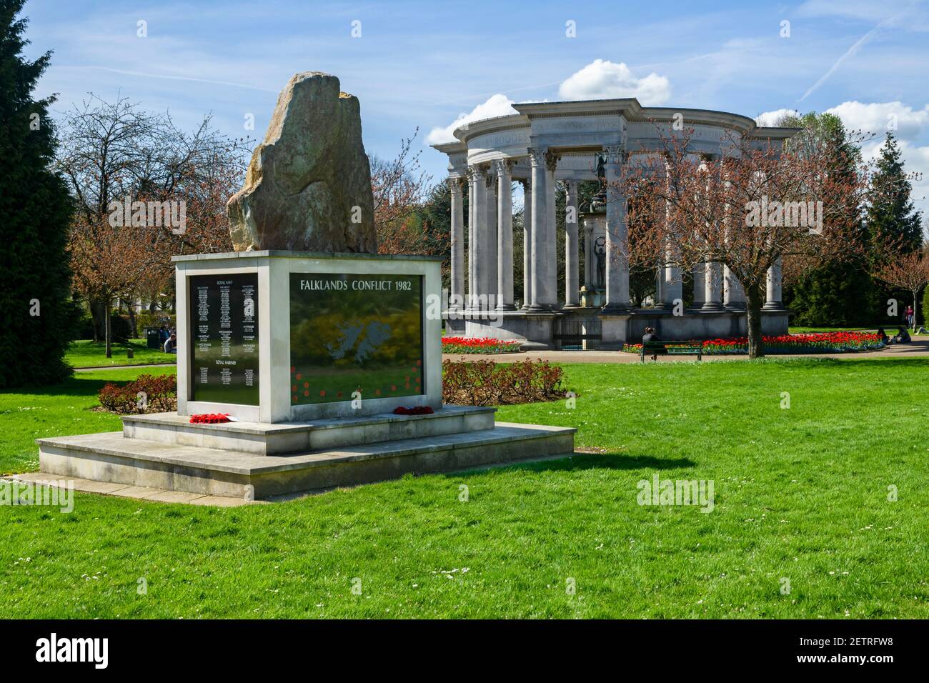 Memorials - Welsh National War Memorial & Falklands Stone of Remembrance (poppy wreaths) in sunny scenic park - Alexandra Gardens, Cardiff, Wales, UK. Stock Photo