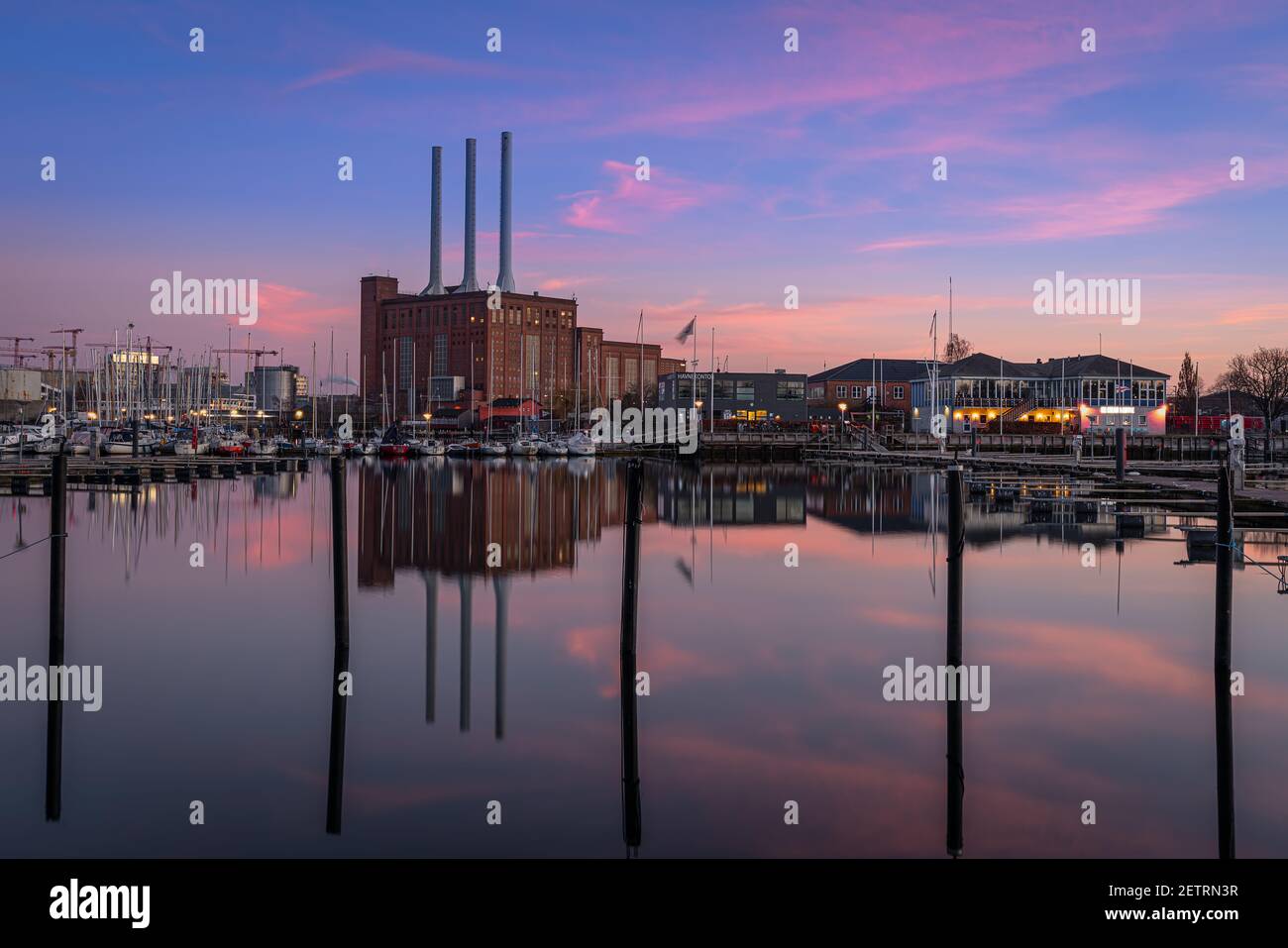 Svanemolle Power Station and the local Marina at dusk Stock Photo