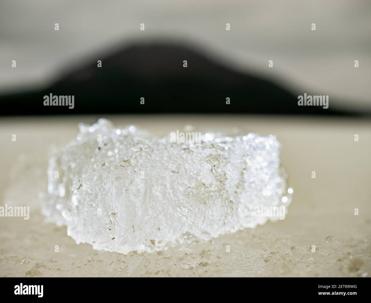 Brightened piece of ice. The structure of radiant ice broken off from ...