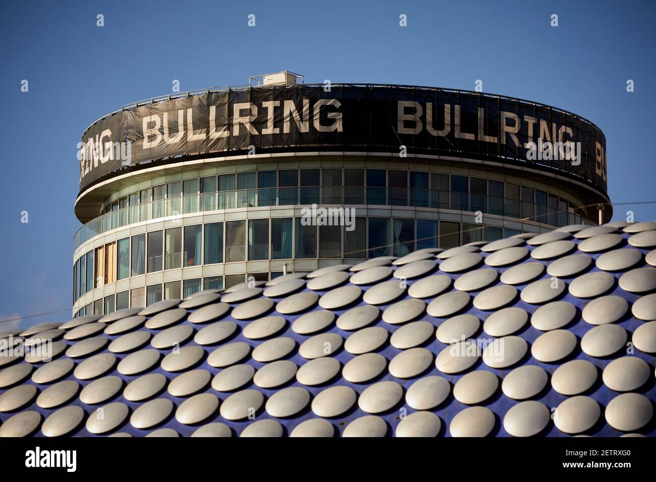 Birmingham Grade II listed Rotunda Bullring is a cylindrical highrise building towers over the Selfridge Building Stock Photo