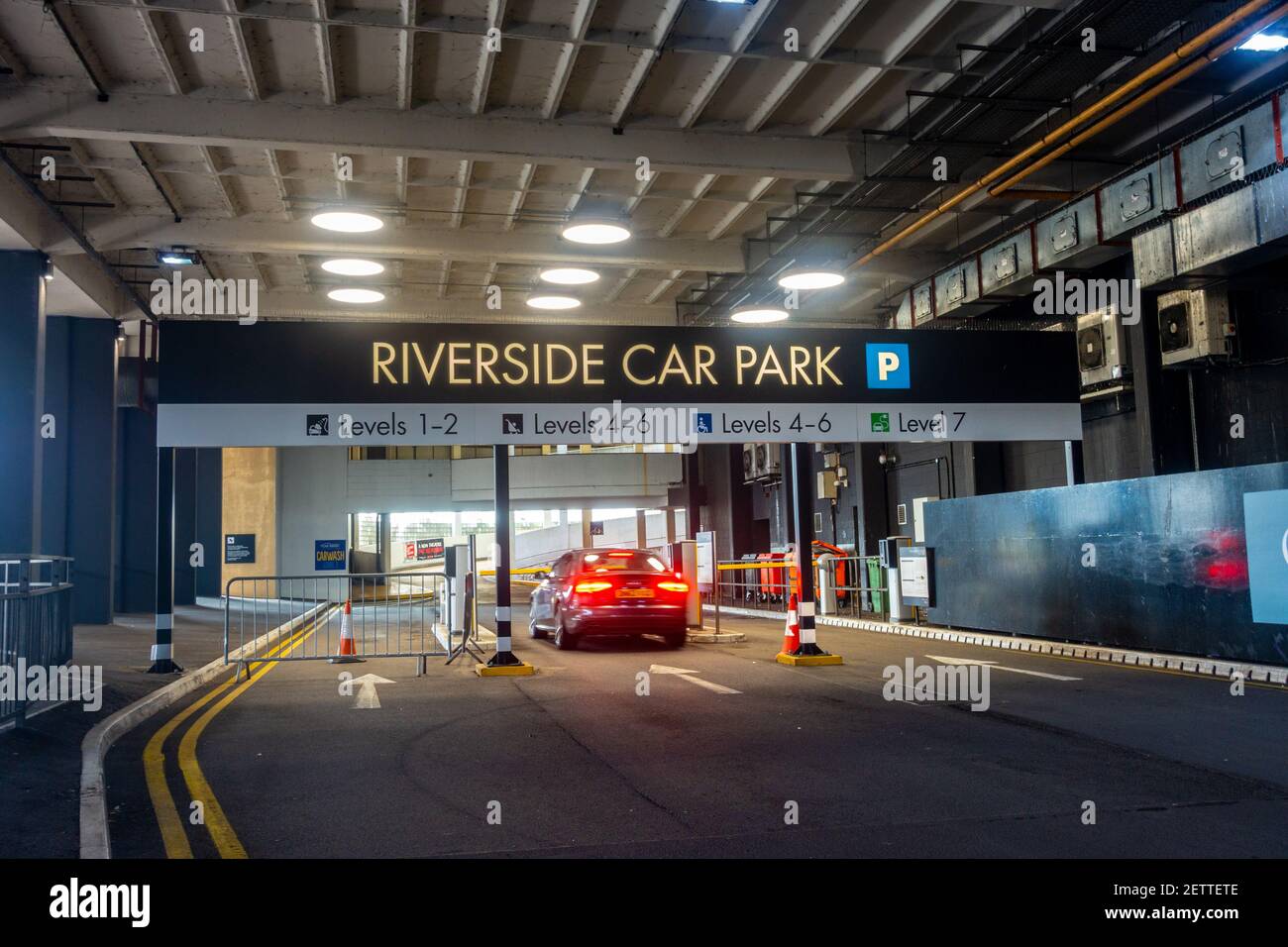 A car enters The Riverside multi-storey car park, part of The Oracle Shopping Centre in Reading, UK Stock Photo