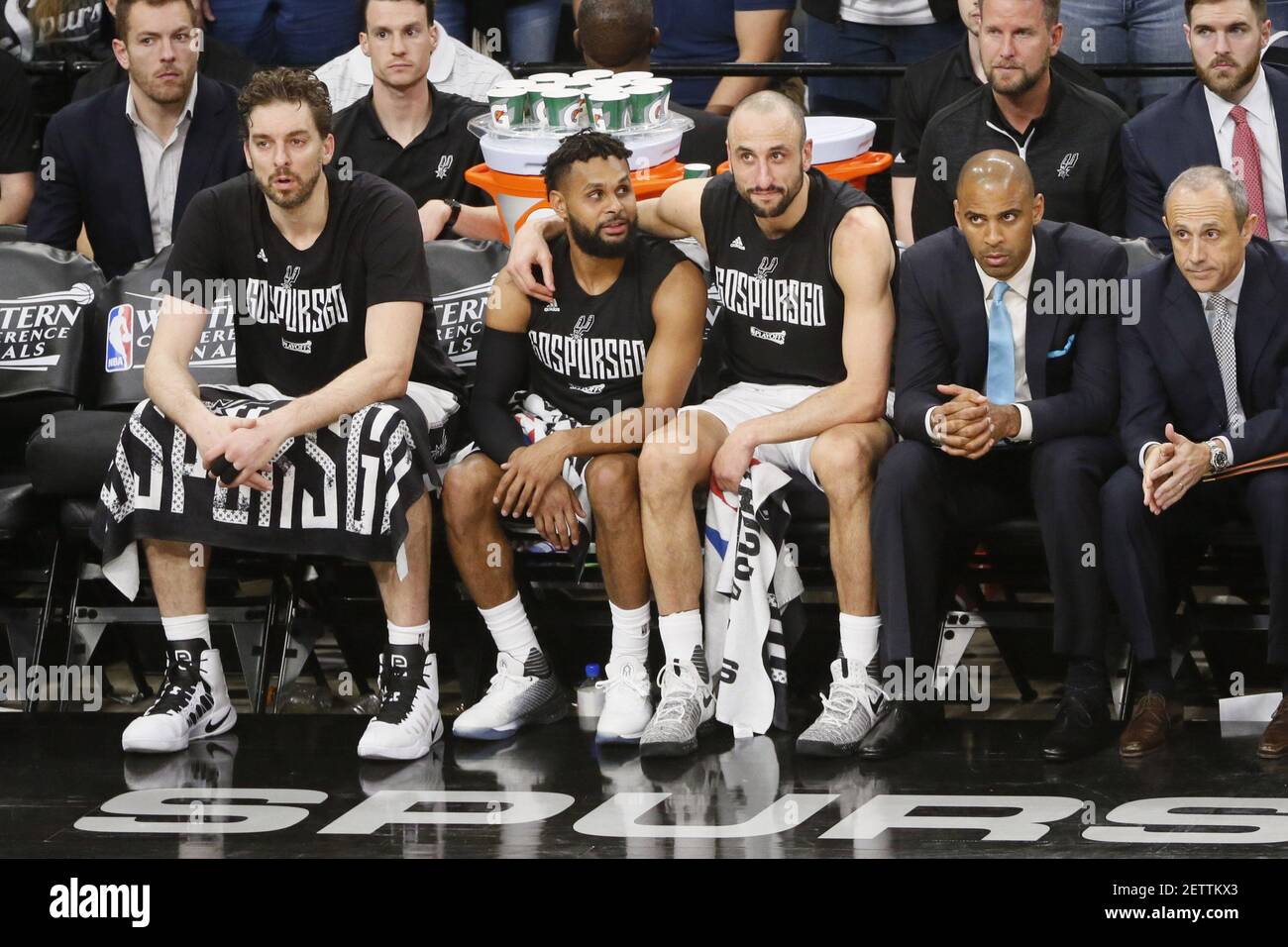 May 22, 2017; San Antonio, TX, USA; San Antonio Spurs players (from left to  right) Pau Gasol (16) Patty Mills (8) and Manu Ginobili (20) watch on the  bench during the second