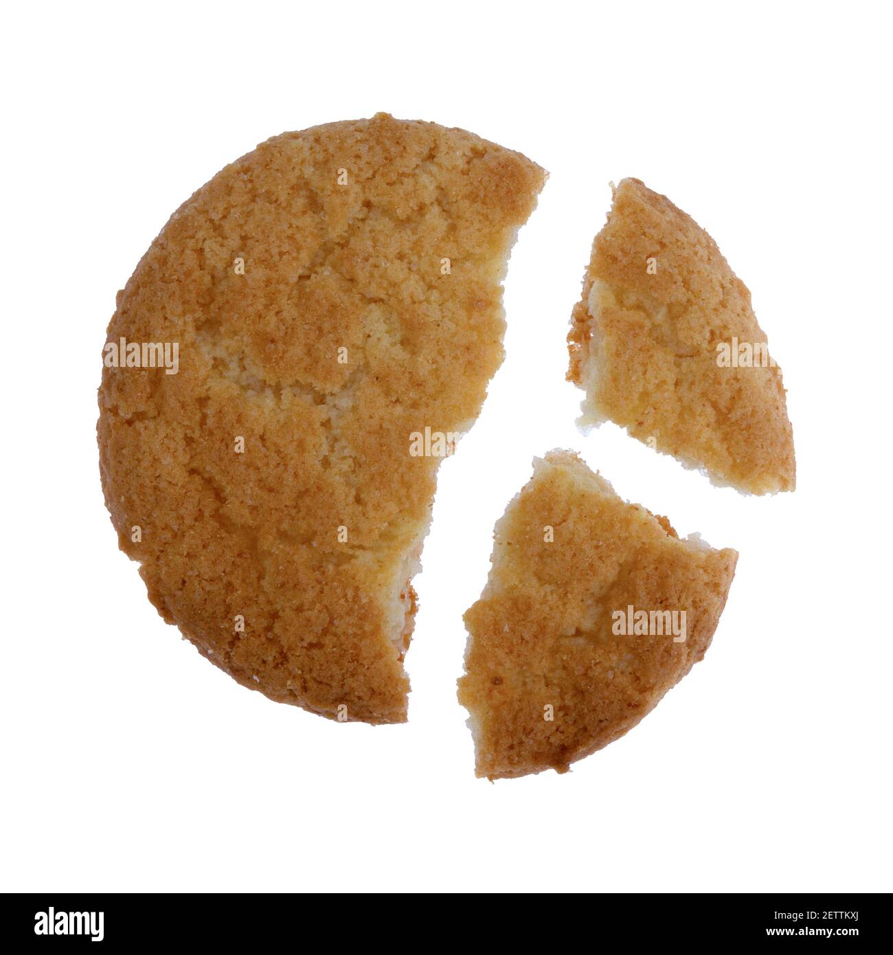 Single coconut flavor cookie that is broken in three pieces isolated on a white background. Stock Photo