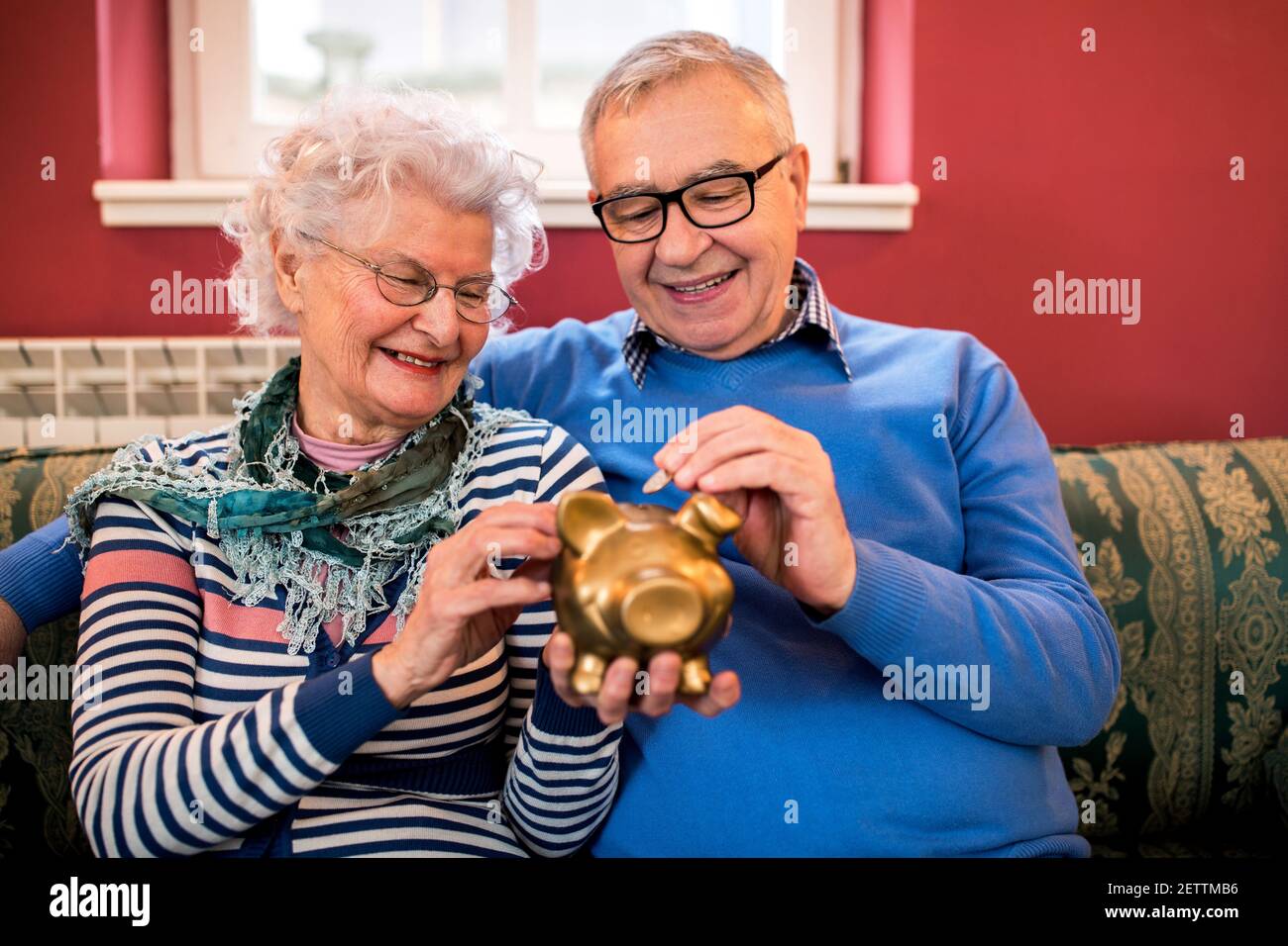 Elderly woman puts coin in hi-res stock photography and images - Alamy