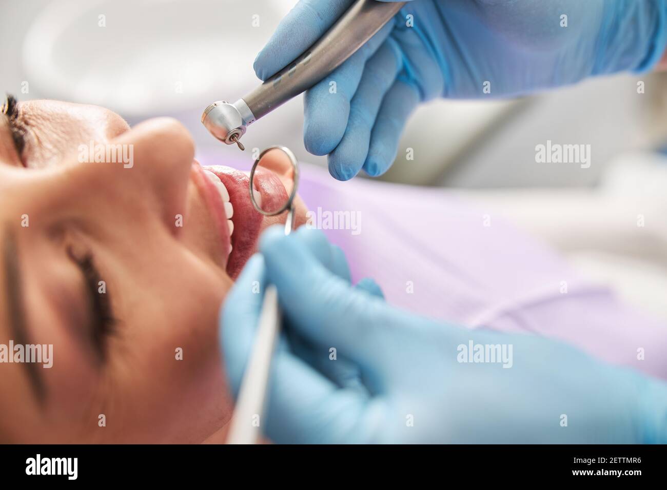 Zoomed In Tooth Medical specialist zooming on teeth with mouth mirror Stock Photo - Alamy