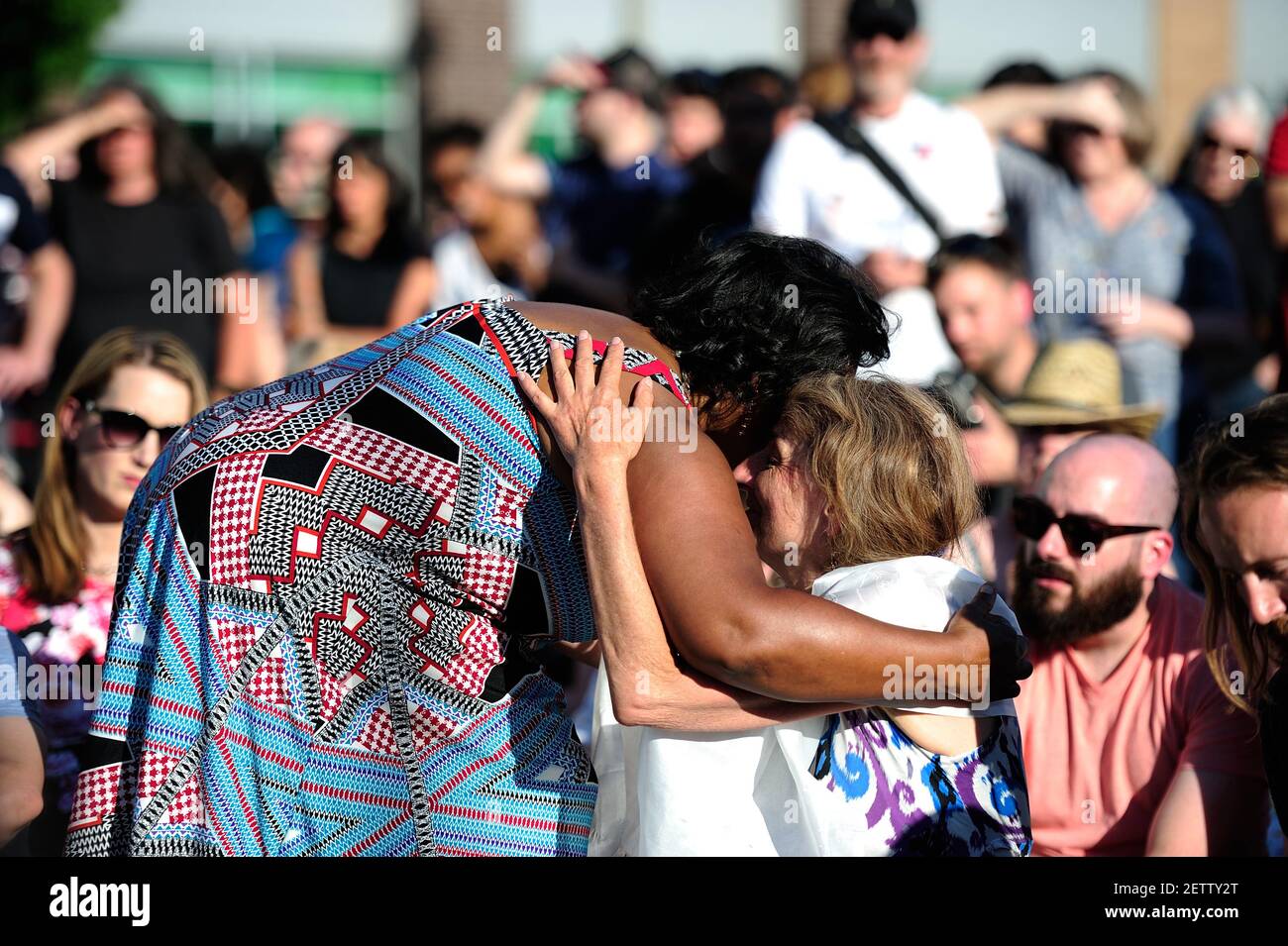 A woman comforts the mother of 23-year-old Taliesin Myrddin during a ...