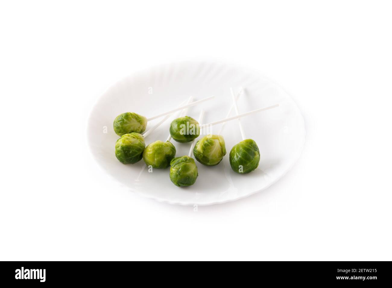 Set of brussel sprouts with lollipop sticks on white background Stock