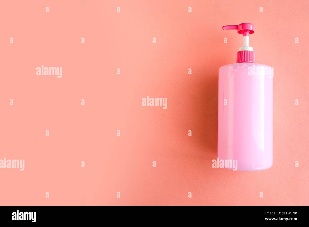 https://c8.alamy.com/comp/2ETW5N0/bottle-with-pink-dishwashing-liquid-on-pink-background-minimal-concept-copy-space-for-the-text-2ETW5N0.jpg