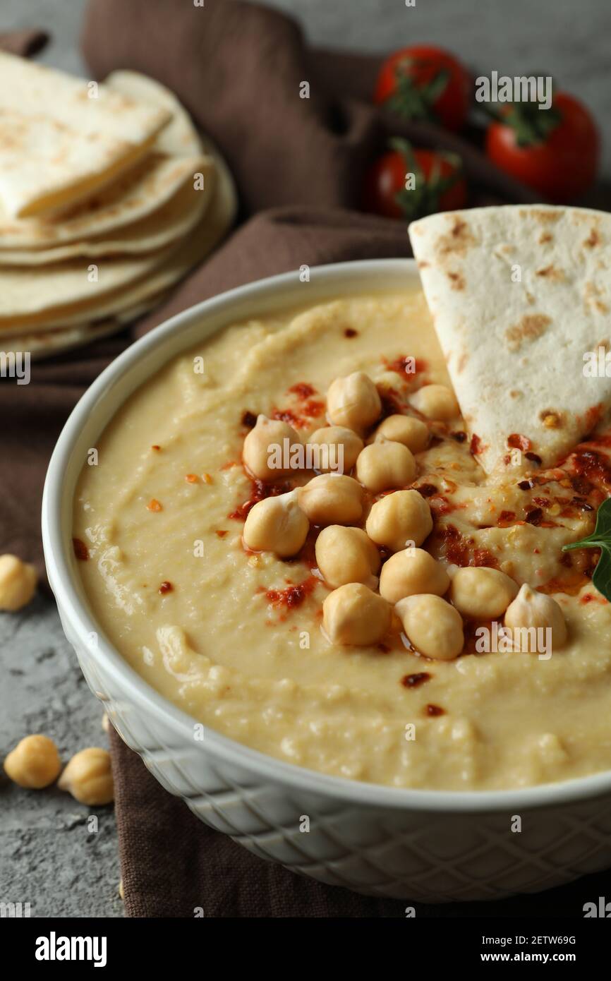Concept of tasty eat with hummus and pita on gray background Stock Photo
