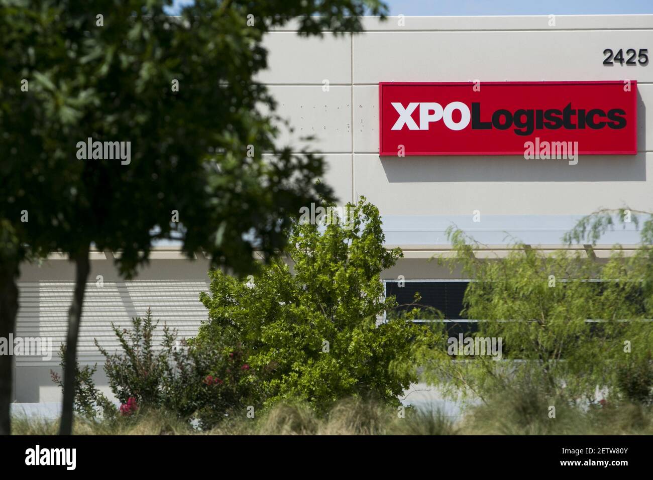 A logo sign outside of a facility occupied by XPO Logistics, Inc., in