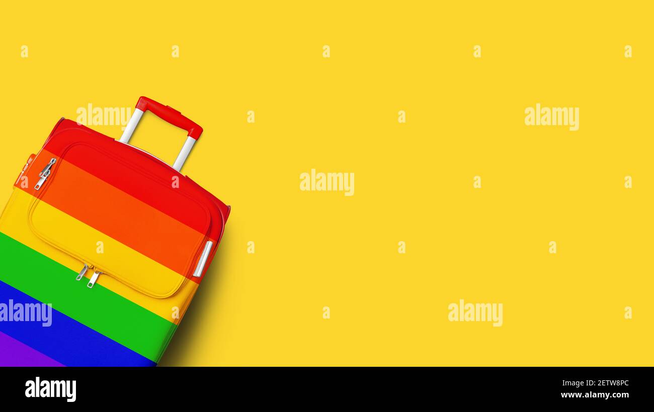 Suitcase LGBTQ community flag colors, rainbow baggage, colorful luggage, trolley bag yellow background, LGBT pride people travel banner, vacation Stock Photo