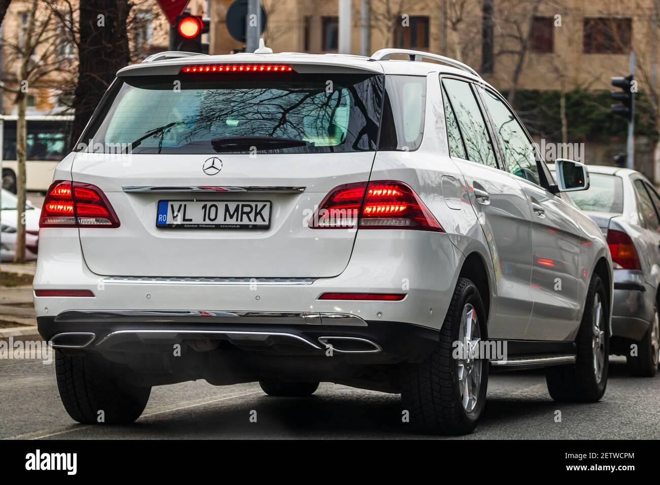 White Mercedes back view suv in traffic in Bucharest, Romania, 2021