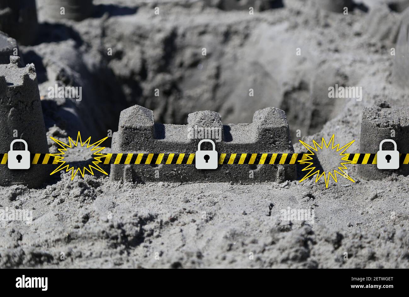Beach sand castle security wall metaphor protecting computer and networks from virus and malware threats Stock Photo