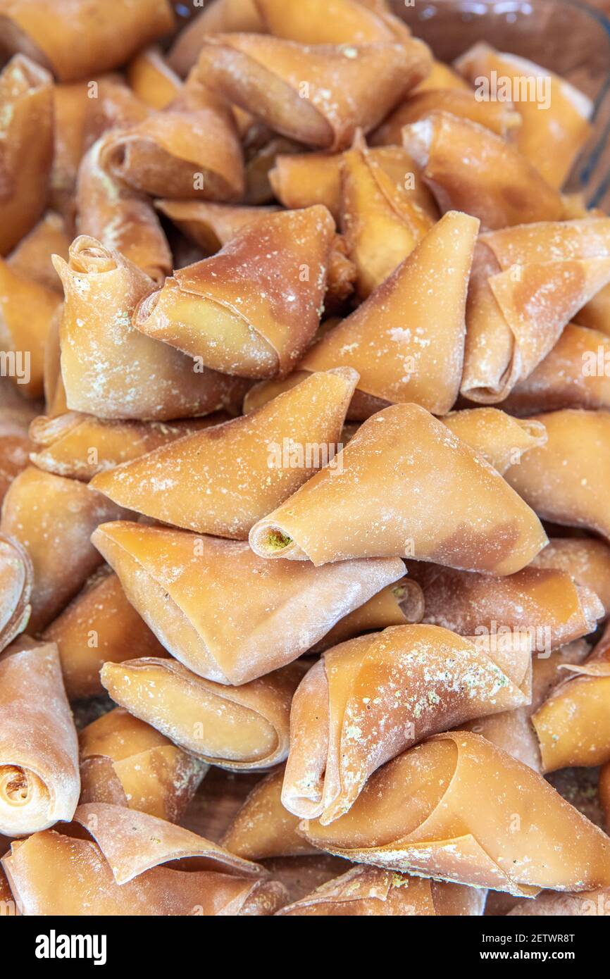 Traditional Turkish sweet dessert pestil or muska dried fruit pulp snack. Stock Photo