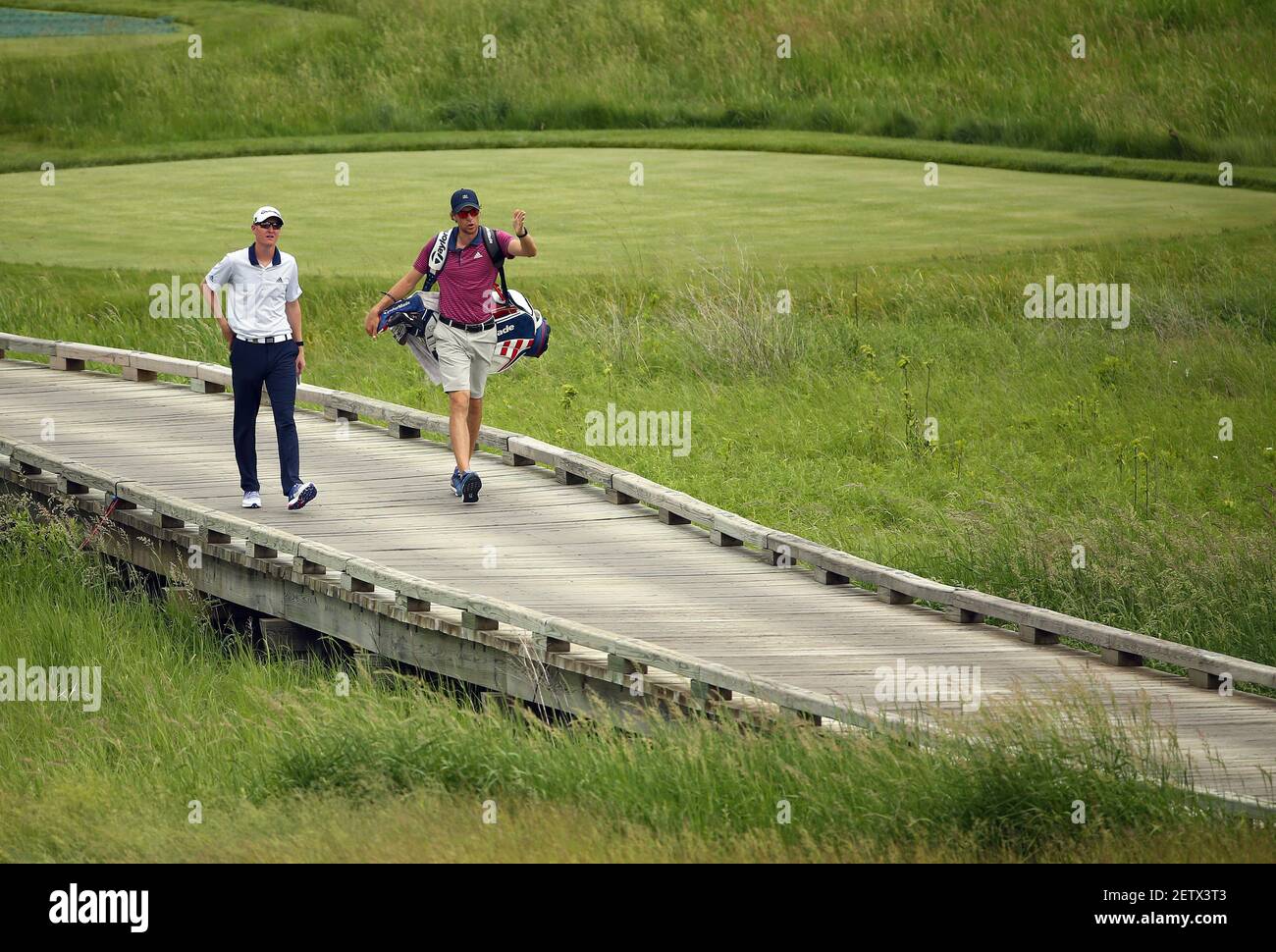 Jun 12, 2017; Erin, WI, USA; Jordan Niebrugge walks off the second tee during the opening practice round of the U.S. Open golf tournament at Erin Hills. Mandatory Credit: Rob Schumacher-USA TODAY Sports *** Please Use Credit from Credit Field *** Stock Photo