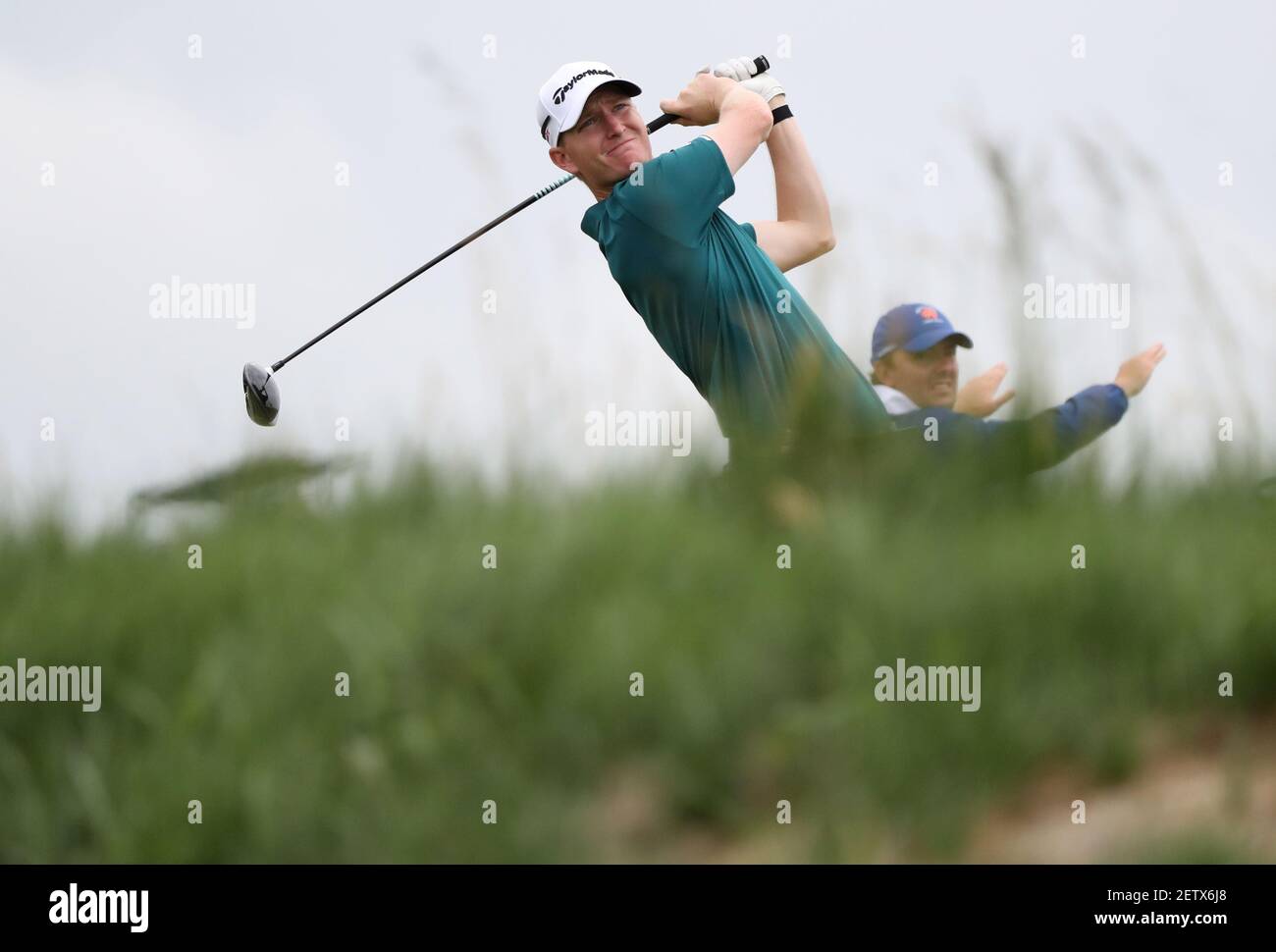 Jun 13, 2017; Erin, WI, USA; Jordan Niebrugge plays his shot from the 12th tee during a practice round of the U.S. Open golf tournament at Erin Hills. Mandatory Credit: Geoff Burke-USA TODAY Sports *** Please Use Credit from Credit Field *** Stock Photo