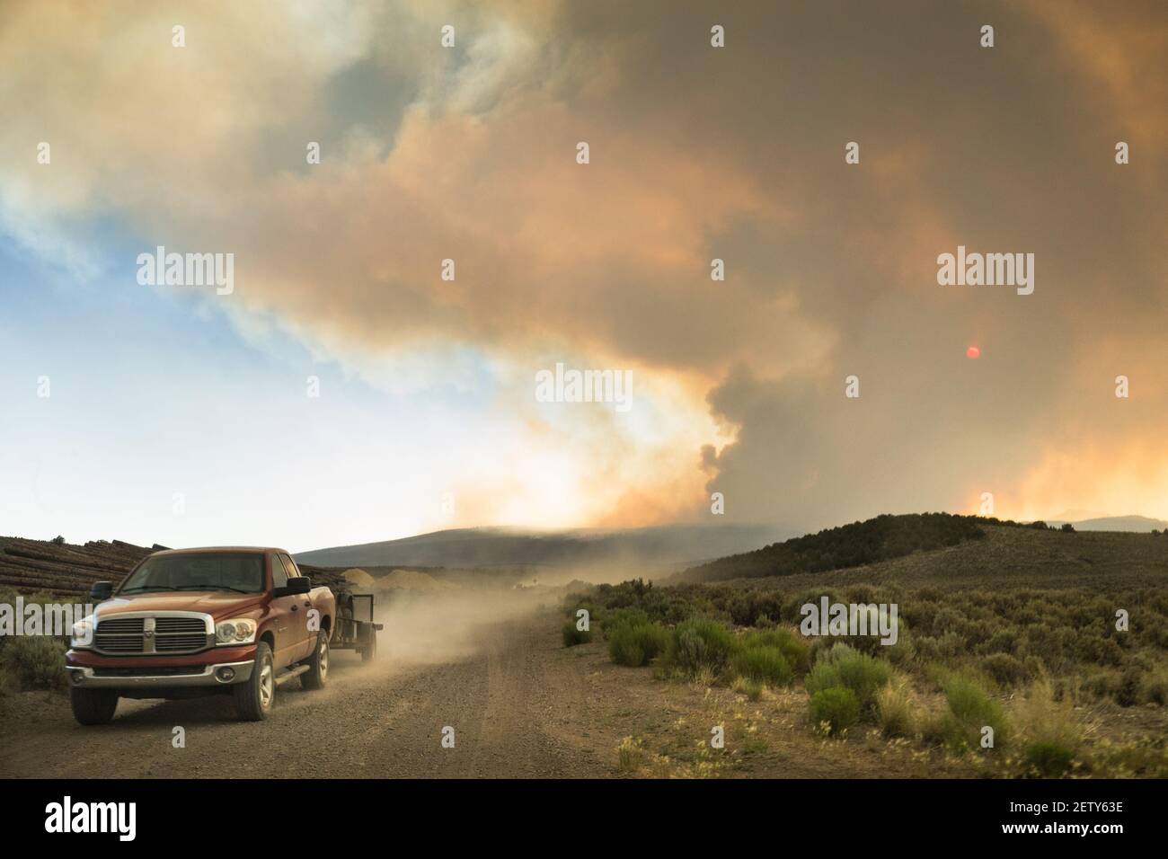 Smoke from the Brian Head wildfire pours over the evacuated town of Panguitch near Bryce Canyon National Park in Utah on June 28, 2017. The fire, which began on June 17 at the resort town Brian Head along the Utah-Idaho border, is now the largest active wildfire in the US at 78 square miles. It has burned 13 homes and forced the evacuation of over 1,500 people. (Photo by Annabelle Marcovici) *** Please Use Credit from Credit Field *** *** Please Use Credit from Credit Field *** Stock Photo