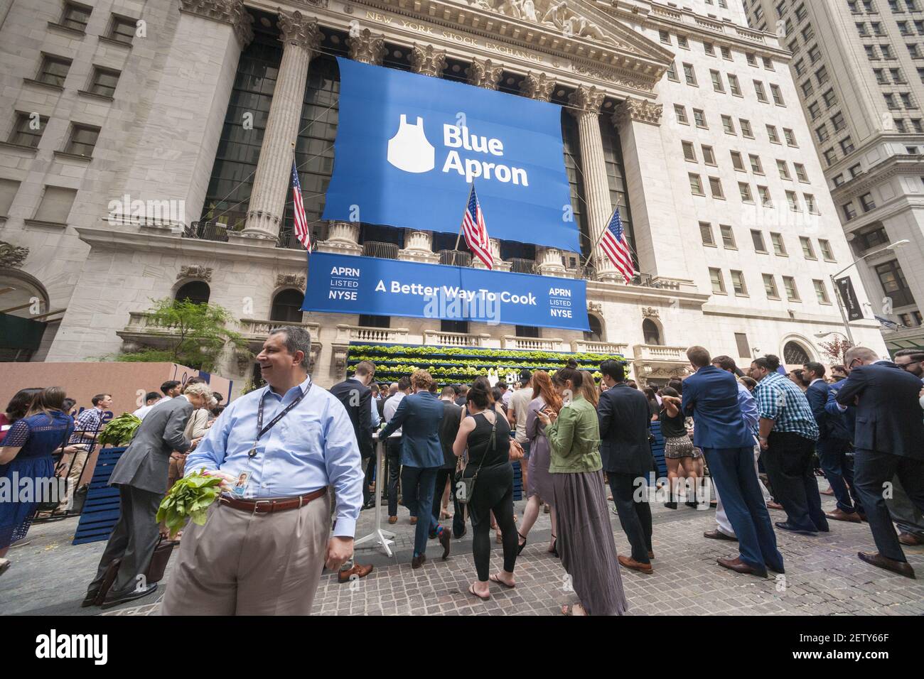 Broad Street in front of the New York Stock Exchange is agog with activity  during the ceremony for the initial public offering of Blue Apron Holdings,  a meal-kit delivery service, on Thursday,