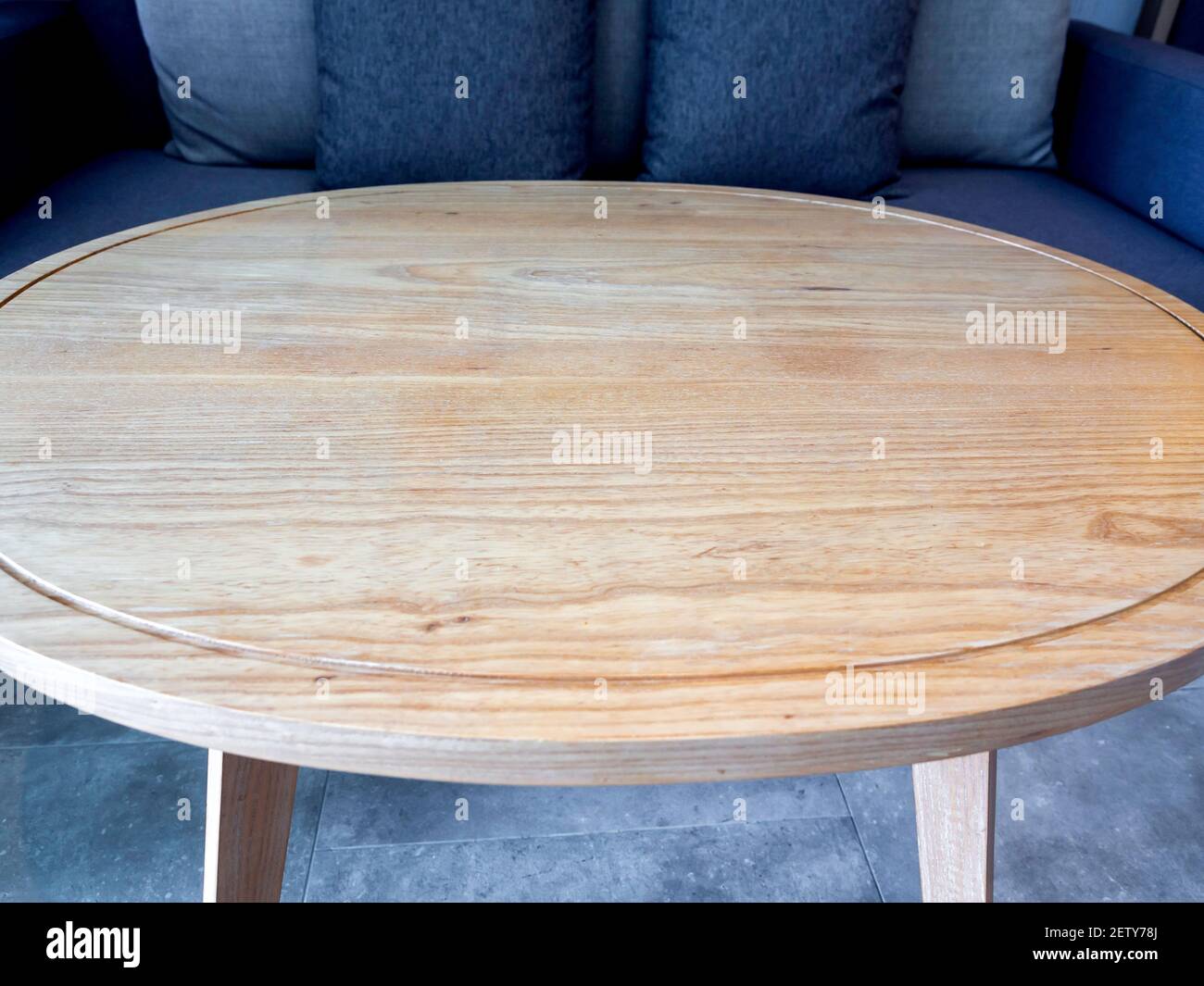 Round wooden table. Closeup empty light brown round wood table top near