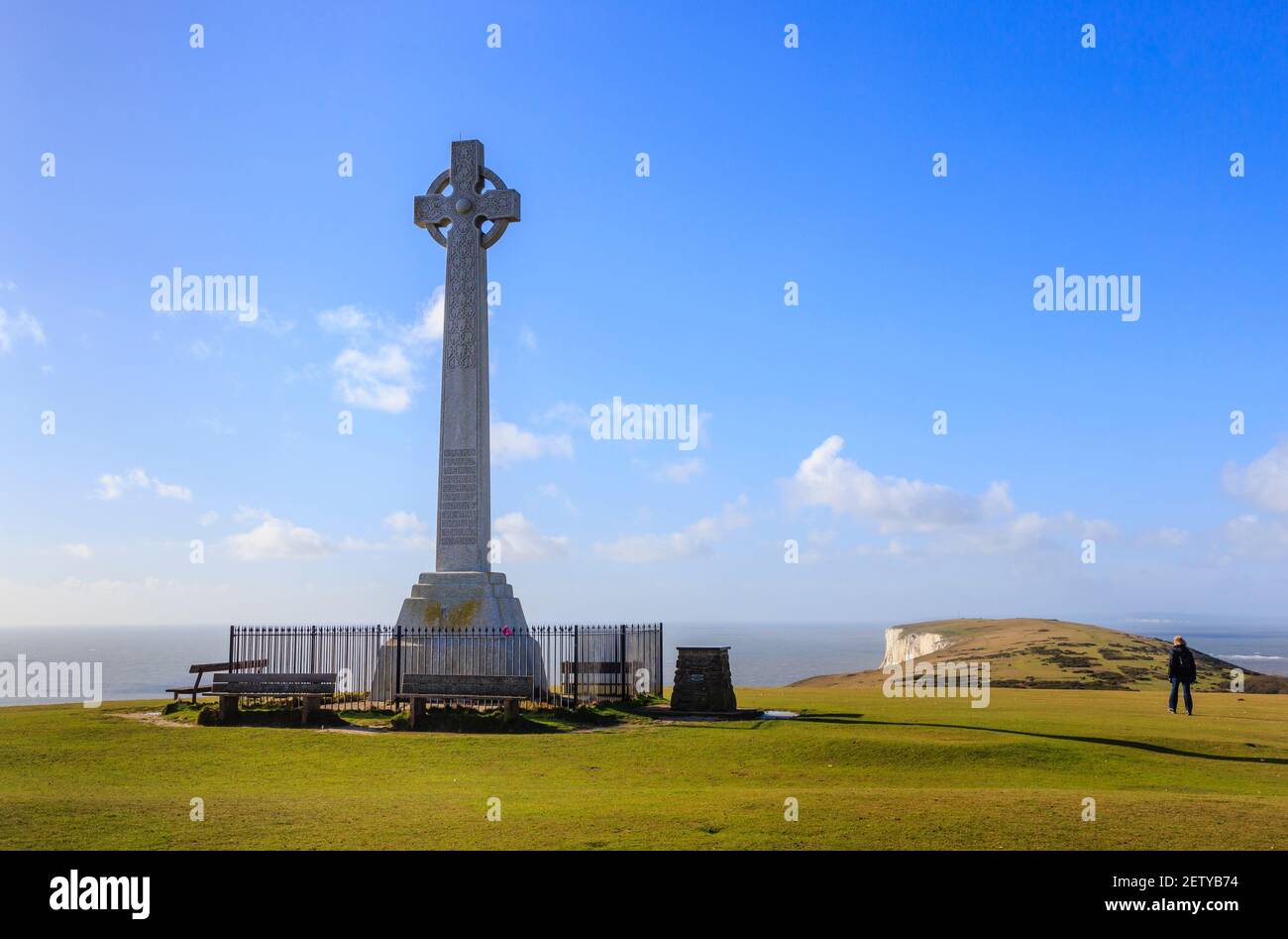 The Tennyson Memorial erecterd in 1897 on Tennyson Down in the Needles Country Park, Freshwater, Isle of Wight, southern England, against a blue sky Stock Photo