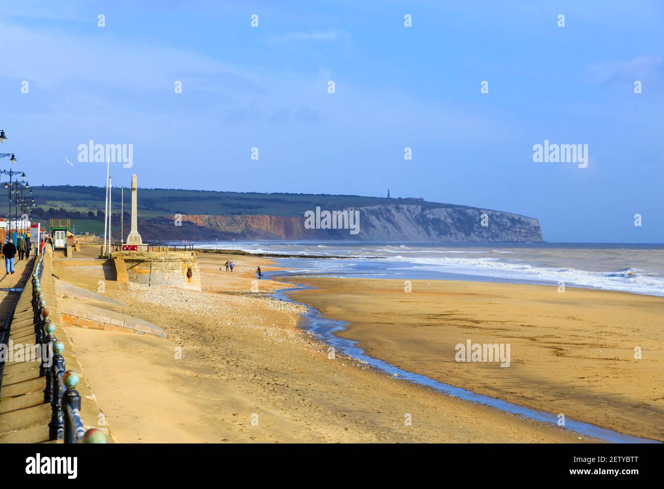 Panoramic view along Sandown sandy beach, shoreline and cliffs at low tide, Sandown, south-east coast of the Isle of Wight, southern England in winter Stock Photo