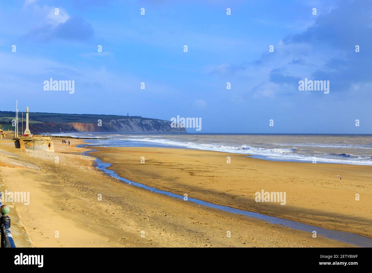 Panoramic view along Sandown sandy beach, shoreline and cliffs at low tide, Sandown, south-east coast of the Isle of Wight, southern England in winter Stock Photo