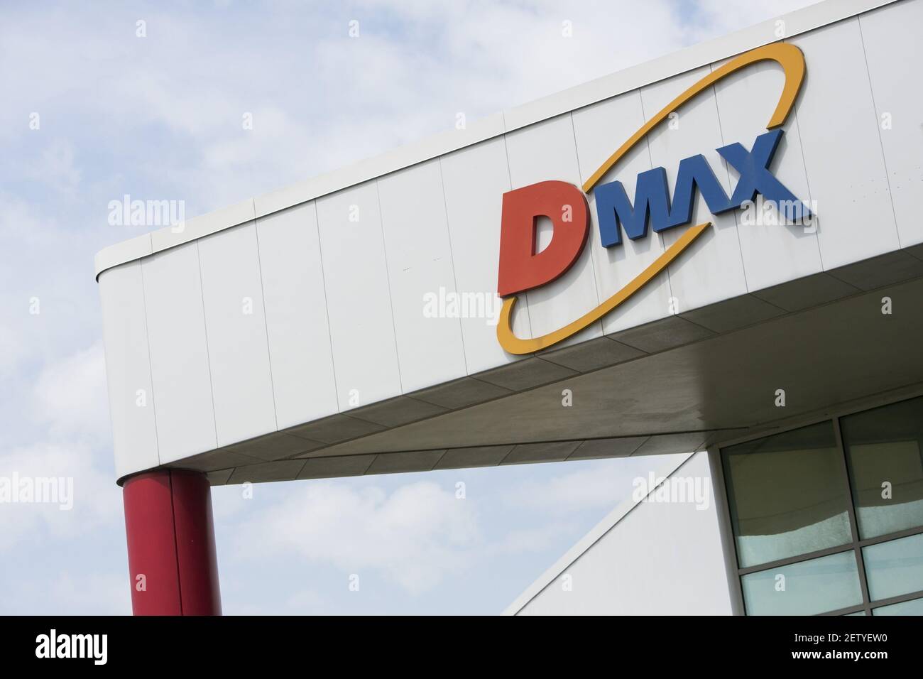 A logo sign outside of the headquarters of the Dmax engines factory in