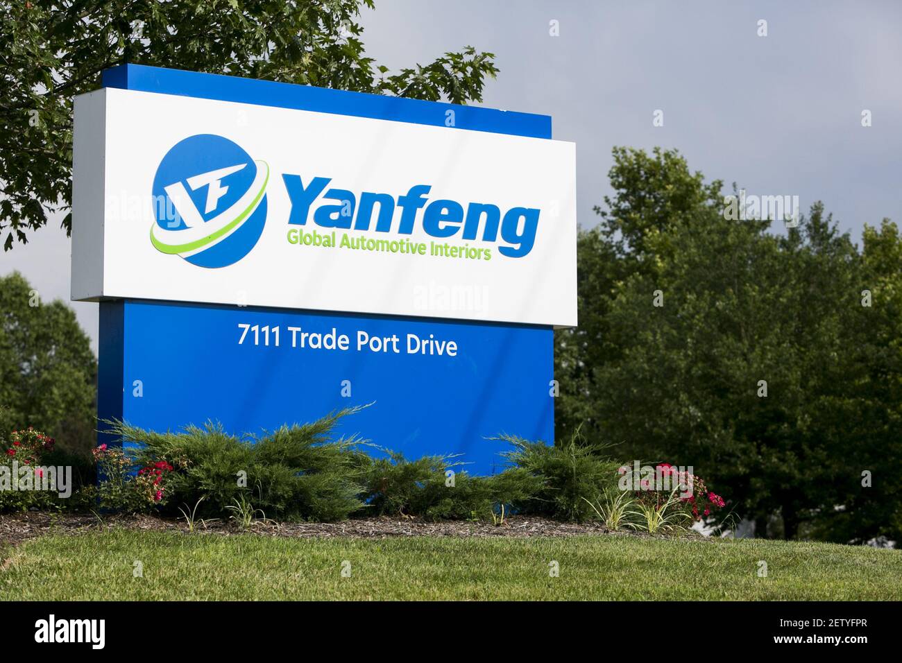 A logo sign outside of a facility occupied by Yanfeng Automotive