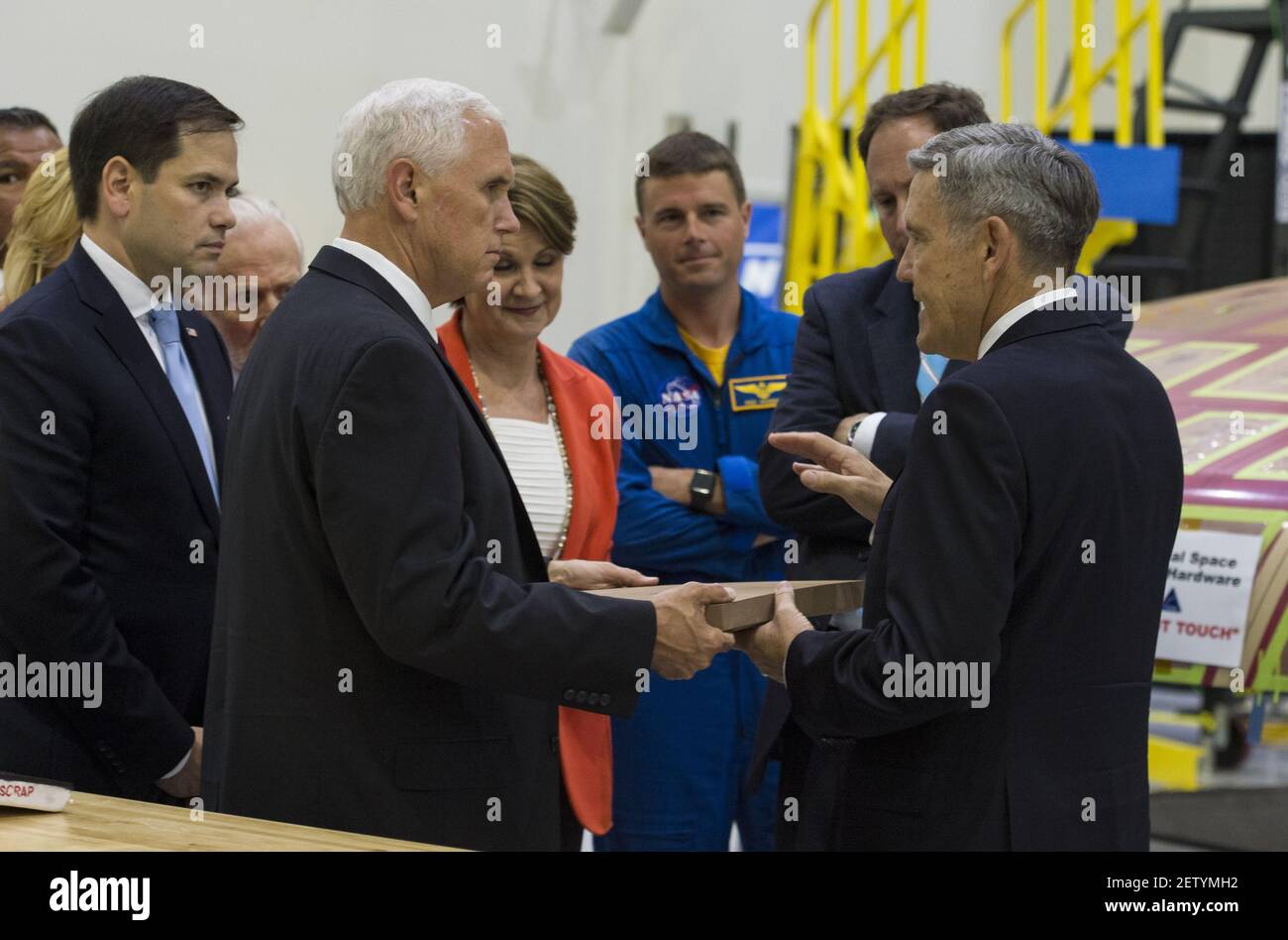 In this photo released by the National Aeronautics and Space Administration (NASA) United States Vice President Mike Pence, left, looks at a component of Orion’s heat shield during a visit to the Operations and Checkout Building at Kennedy Space Center (KSC) on Thursday, July 6, 2017 in Cape Canaveral, Florida. Looking on from left is US Senator Marco Rubio (Republican of Florida). (Photo by Aubrey Gemignani/NASA via CNP)*** Please Use Credit from Credit Field ***  Stock Photo