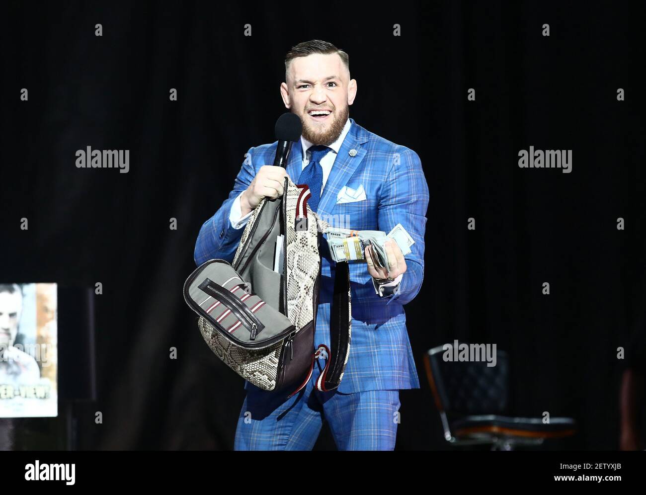 Jul 12 2017 Toronto Ontario Canada Conor Mcgregor Reacts As He Takes Cash From A Money Bag Brought Onto The Stage By Floyd Mayweather During A World Tour Press Conference To Promote