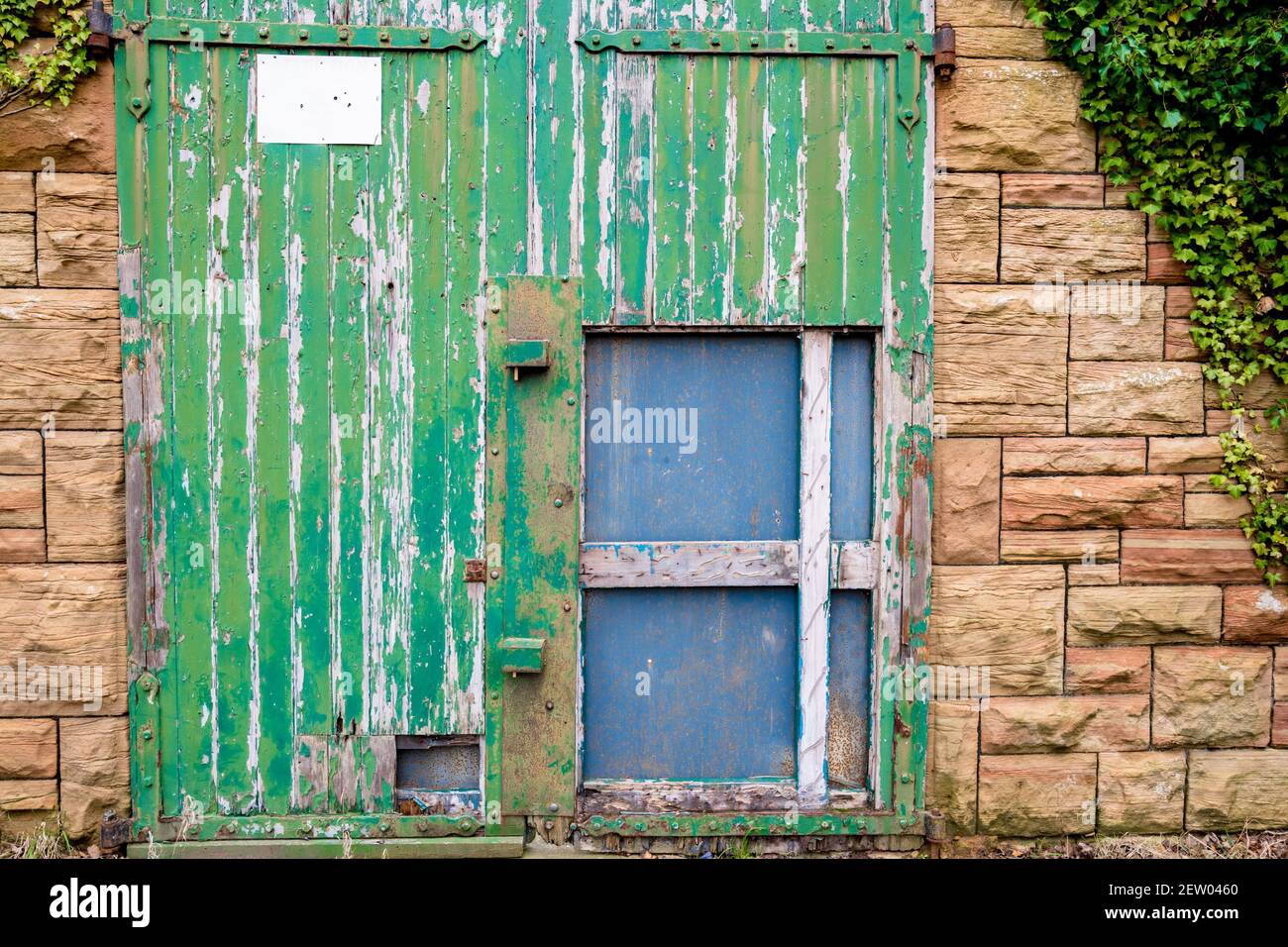 Old decaying green barn door Stock Photo Alamy