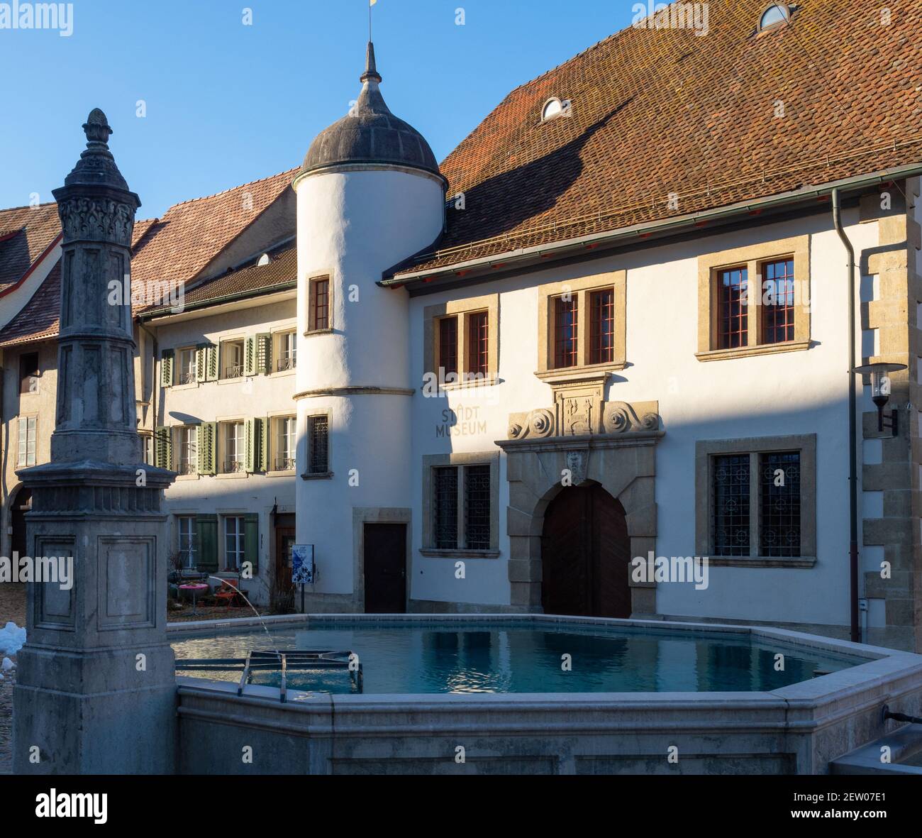 Brugg AG, Switzerland - January 1st 2021: Historic centre: Fountain and houses Stock Photo